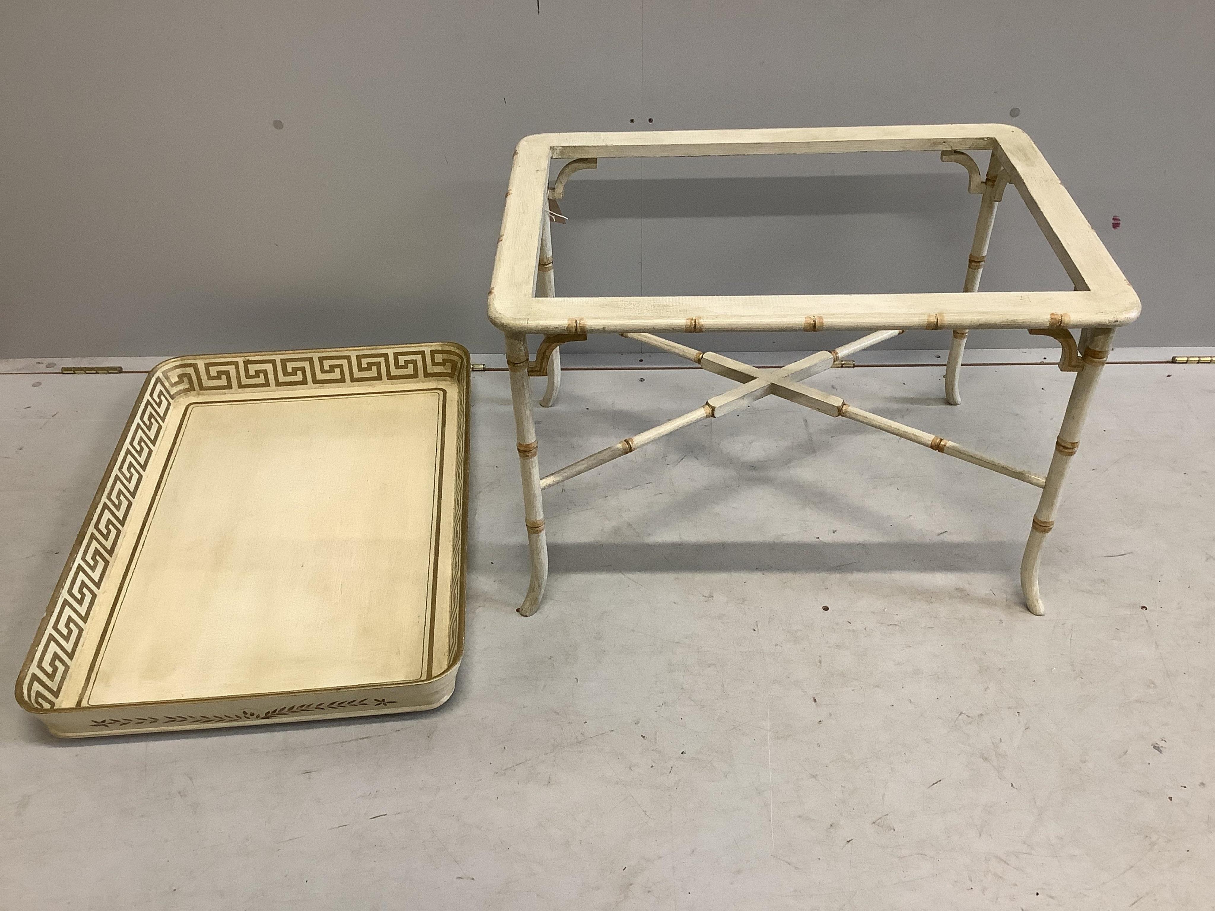 A Regency style rectangular cream painted tray top table, with faux bamboo stand, width 77cm, depth 55cm, height 58cm. Condition - good